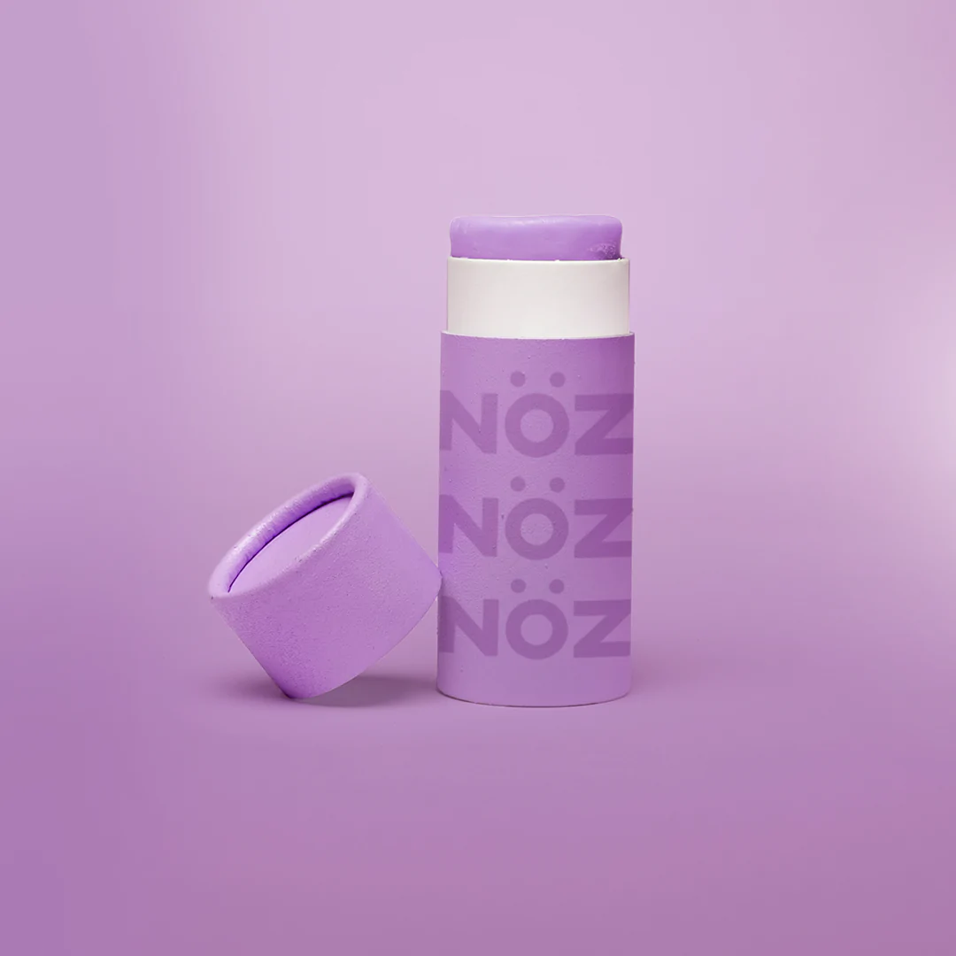 View of NOZ stick sunscreen in purple. 